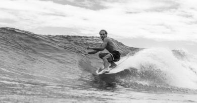 surfing riding the nose on a longboard