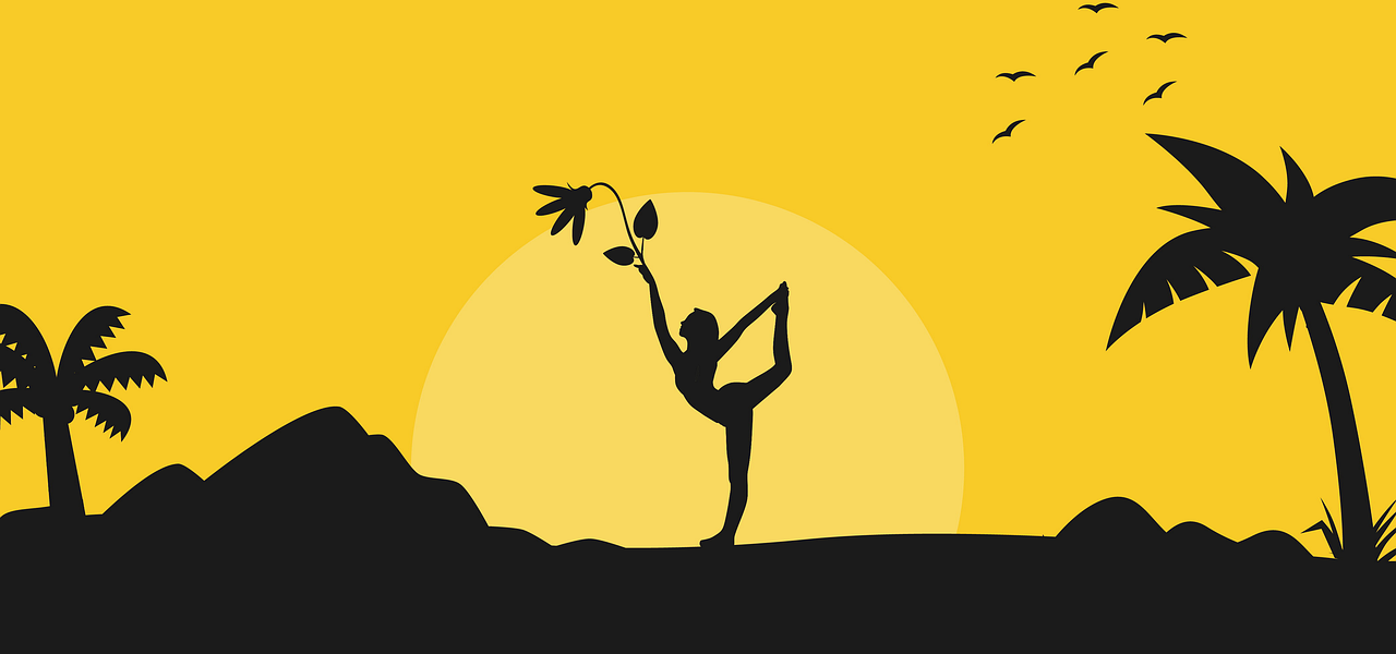 a lady doing yoga infront of the sun